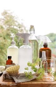 Assortment of cleanr and amber colored spray bottles filled with all natural cleansers. 